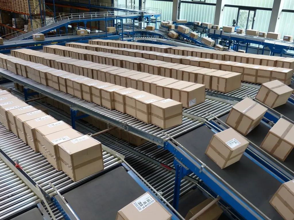 Brown shipping boxes moving along roller conveyors